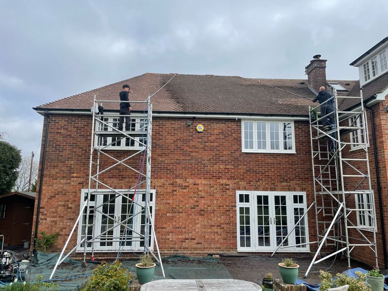 Roof cleaning carried out safely from scaffold towers by The Roof Moss Cleaners in Bromham
